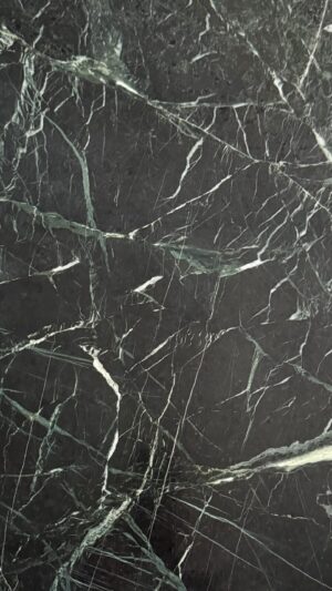 Zorba Green marble slab with deep green base and bold white veining